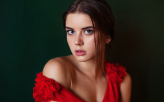 Red dress green background portrait - a green wall behind her free wallpaper