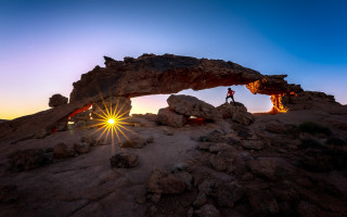 Person rock formation sunset arch - wide angle len free wallpaper for desktop