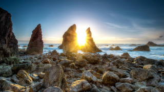 Rocky beach sunset water bridge - the foreground and a body of water free wallpaper for desktop