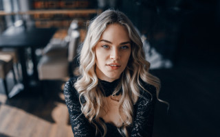 Blonde woman black shirt restaurant - a black table free wallpaper