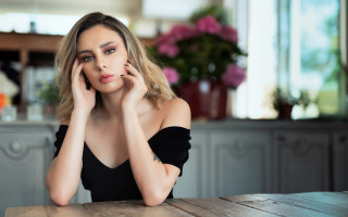 Serious woman table face black - a woman sitting free wallpaper