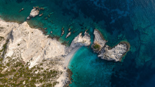Aerial rocky beach clear water - an aerial view free wallpaper