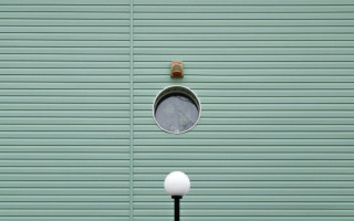 Green wall round window light - geometric shape free wallpaper