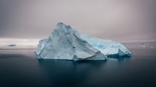 Large iceberg ocean cloudy background - a few iceberg free wallpaper