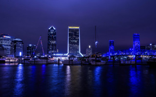 City skyline night reflection boat - the water and a boat free wallpaper