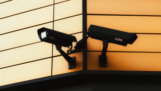 Cameras building wall yellow black - dystopian free wallpaper