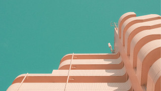 Bird perched building blue sky - modern art deco free wallpaper