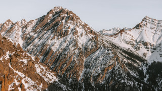 Snowy mountain range bare tree - the top of the mountains free wallpaper