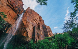 Waterfall rock formation trees blue - a large rock formation free wallpaper