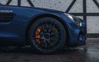 Blue sports car brick wall 3 - rim free wallpaper