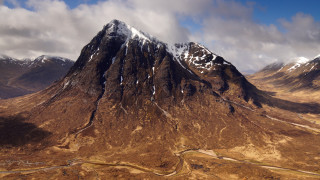 Mountain range winding road cloudy 2 - aerial free wallpaper