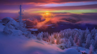 Sunset snowy mountain mystical forest - a sunset over a snowy mountain free wallpaper