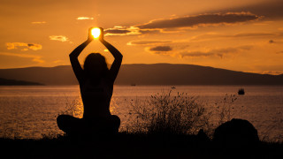 Woman sunset hill water mountains - over the water free wallpaper