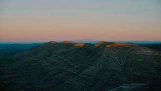 Mountain range sunset pink sky 3 - a view of a mountain range free wallpaper for desktop