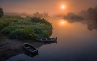 Boat shore river sunset fog - the sun in the distance free wallpaper