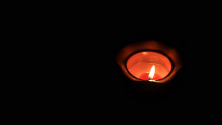 Lit candle dark black background 2 - free light wallpaper for desktop