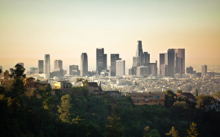 City skyline trees hazy sunset - hazy free wallpaper