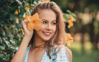 Woman flower smile outdoors bokeh 2 - a flower free wallpaper for desktop