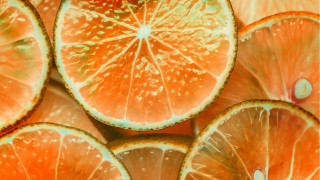 Orange closeup stacked halves water - half free wallpaper