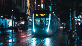 Futuristic cyberpunk bus night cityscape - a bus free wallpaper