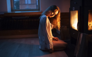 Woman sitting fireplace candle art - a fire place free wallpaper