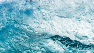 Large wave iceberg swimming ocean - a person swimming free wallpaper