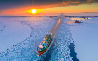 Frozen lake boat sunset mountains - lake free wallpaper
