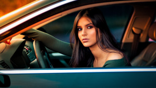 Woman car serious portrait blurry - the steering wheel free wallpaper