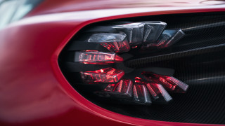 Red sports car side mirror - a red sports car free wallpaper