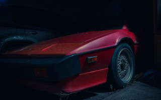 Red sports car dark garage 5 - a dark garage free wallpaper for desktop