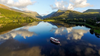 Boat lake mountains clouds reflection - stunning free wallpaper