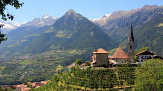 Church hill valley mountains snow - a view of a valley and mountains free wallpaper