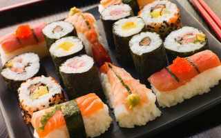 Sushi plate chopsticks fork table - a plate of sushi free wallpaper