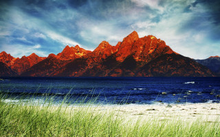 Mountain range over water with - the water and grass free wallpaper