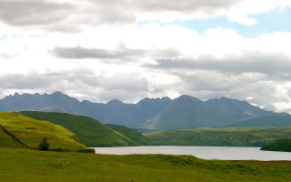 Mountainous horizon ocean landscape cloudy - mountain and grass free wallpaper