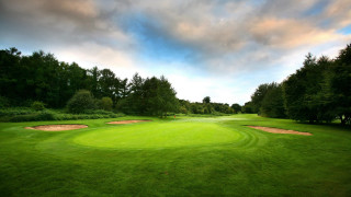Green golf course hole cloudy 2 - free sports wallpaper