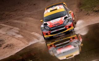 Rally car puddle dirt track - a puddle of water free wallpaper
