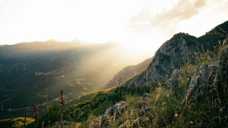 Mountain sunset lake field forest - a grassy field in the foreground free wallpaper