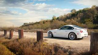 White sports car dirt road 2 - ahmed yacoubi free wallpaper