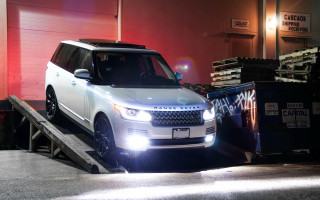 White range rover loaded truck - a red wall behind free wallpaper