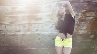 Woman yellow shorts black shirt - fashion photography free wallpaper