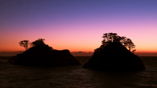Rocks water sunset trees cityscape - top of a body free wallpaper