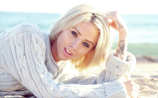 Beach woman blonde sweater ocean - a blue ocean in the background free wallpaper