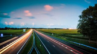 Highway trees night light streaks - a highway free wallpaper