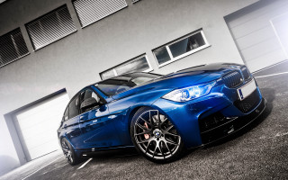 Blue car building garage open - a garage door open free wallpaper