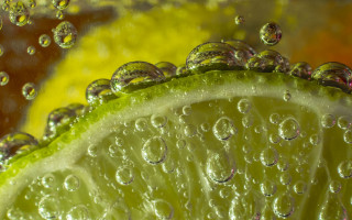 Lime water droplets macro underwater - a yellow background free wallpaper