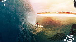 Man riding wave surfboard ocean 30 - a sky background and a caption free wallpaper