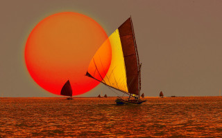 Sailboat yellow red sail ocean 2 - a sailboat free wallpaper