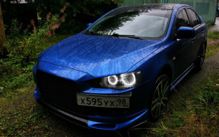 Blue car parked grass road - a blue car free wallpaper