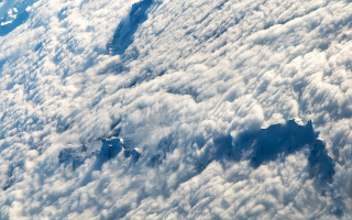 Mountain range airplane wing clouds - cloud below free wallpaper for desktop
